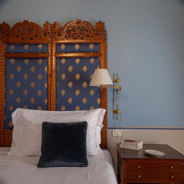 Postel nebo postele na pokoji v ubytování Albergo Pietrasanta