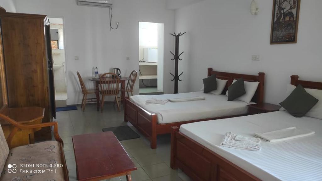 Postel nebo postele na pokoji v ubytování Oasis Beach Resort
