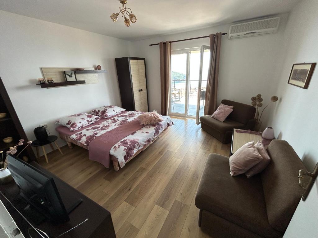 Кровать или кровати в номере Apartments Luna