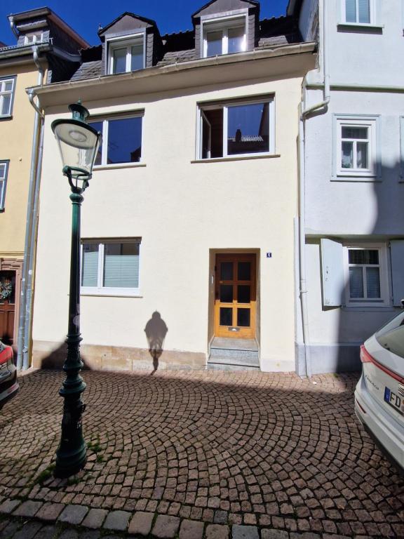 a house with a light pole in front of it at Luckenberg in Fulda