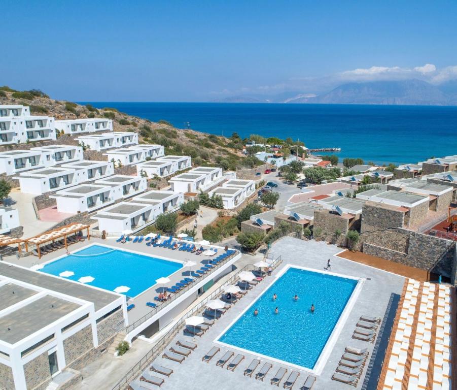 an aerial view of a resort with a swimming pool at Ariadne Beach - Adults Only in Agios Nikolaos