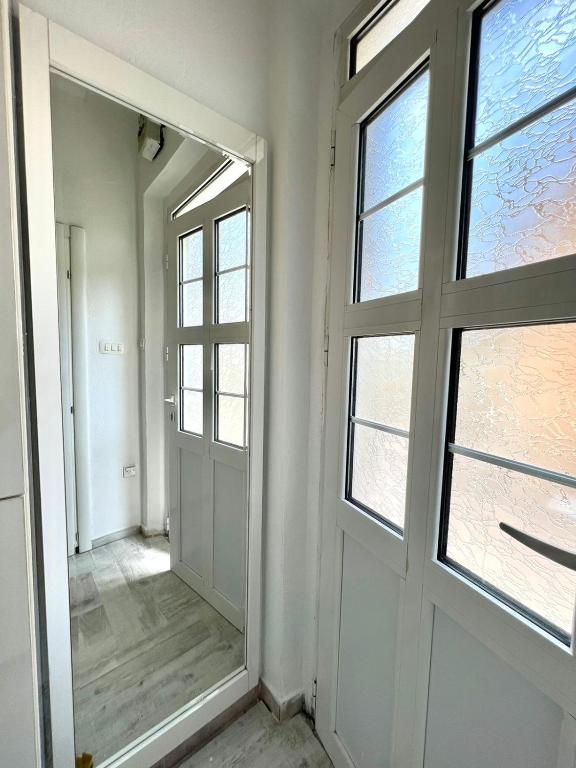 an empty room with a mirror and a window at Apartment Kiki in Kotor