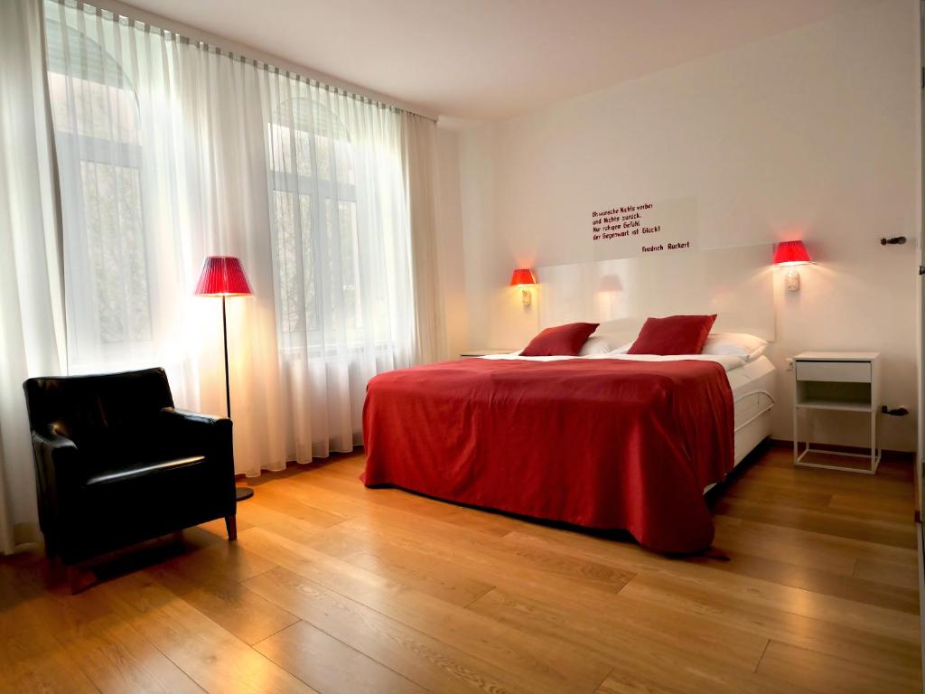 Postel nebo postele na pokoji v ubytování Hotel Villa Rückert