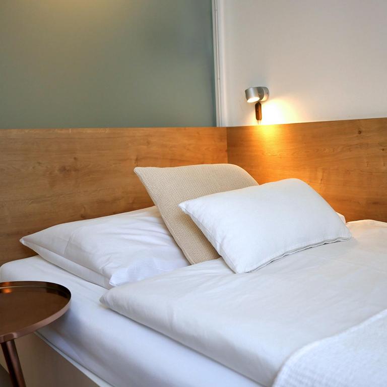 Postel nebo postele na pokoji v ubytování Hotel Villa Rückert