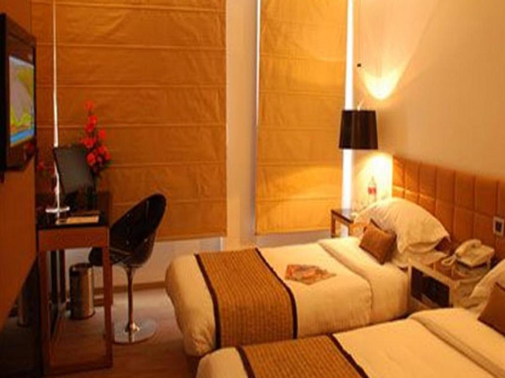 Postel nebo postele na pokoji v ubytování Hotel Palace Heights