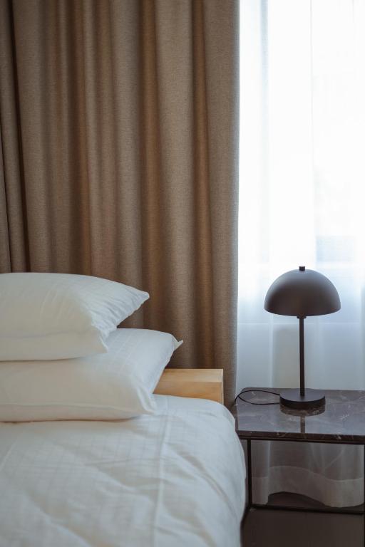 Postel nebo postele na pokoji v ubytování Hotel National Antwerp