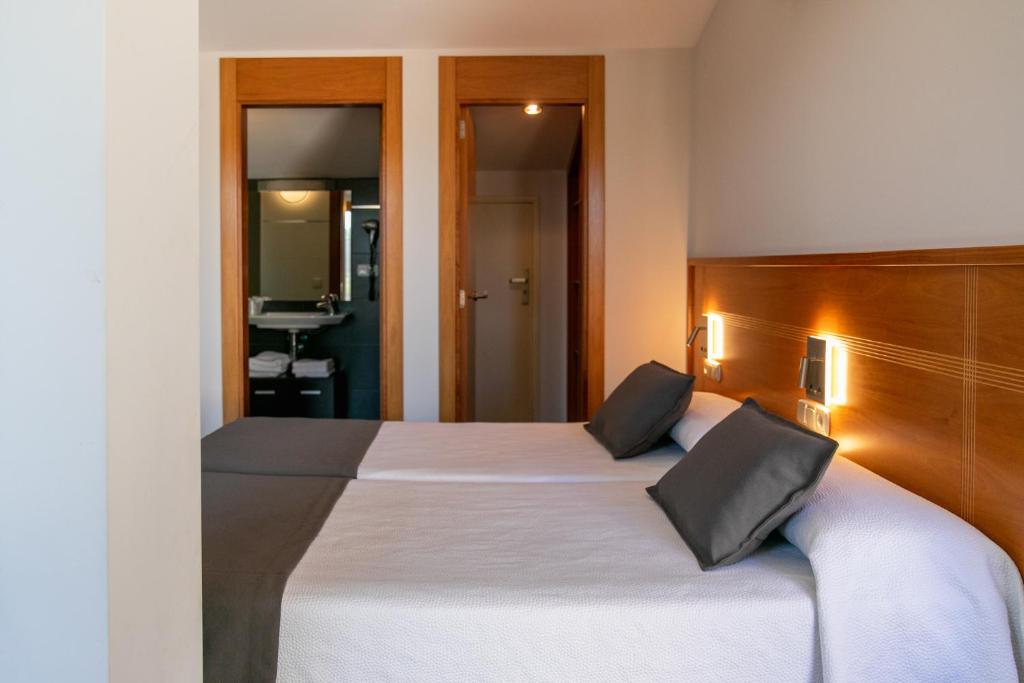 Posteľ alebo postele v izbe v ubytovaní Aparthotel Cal Marçal