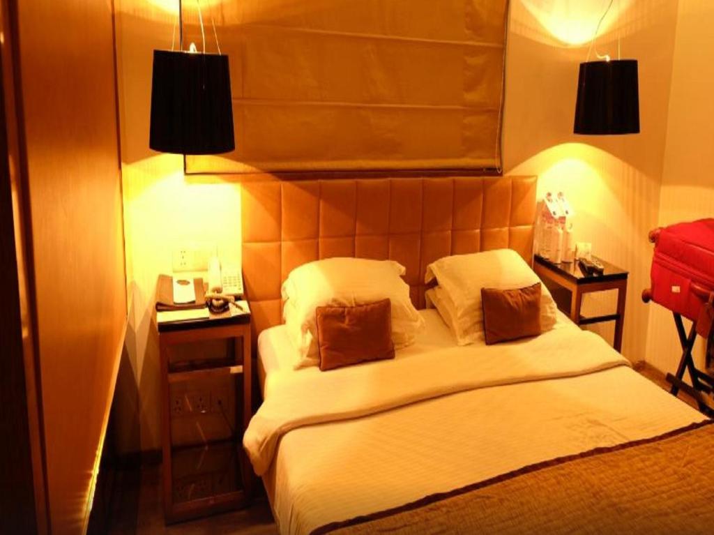 Postel nebo postele na pokoji v ubytování Hotel Palace Heights