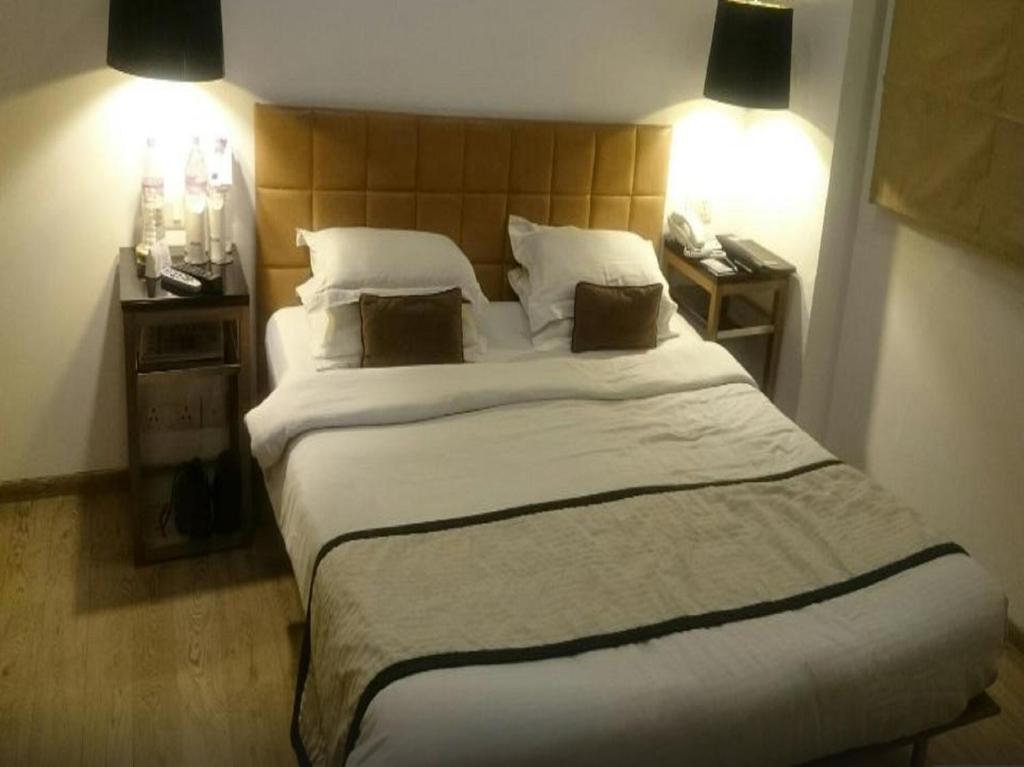 Postel nebo postele na pokoji v ubytování Hotel Palace Heights