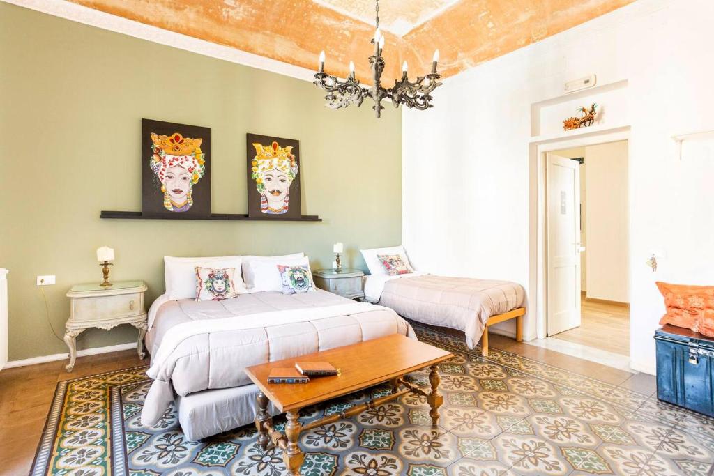 Postel nebo postele na pokoji v ubytování Binario 91 Rooms