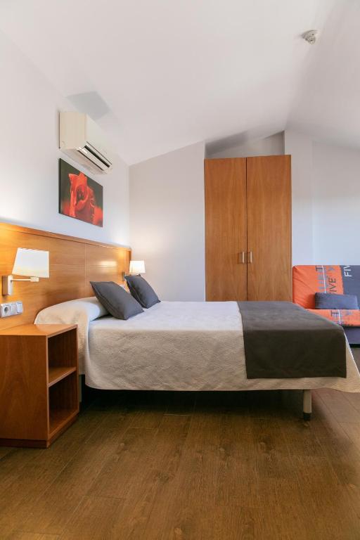 Posteľ alebo postele v izbe v ubytovaní Aparthotel Cal Marçal