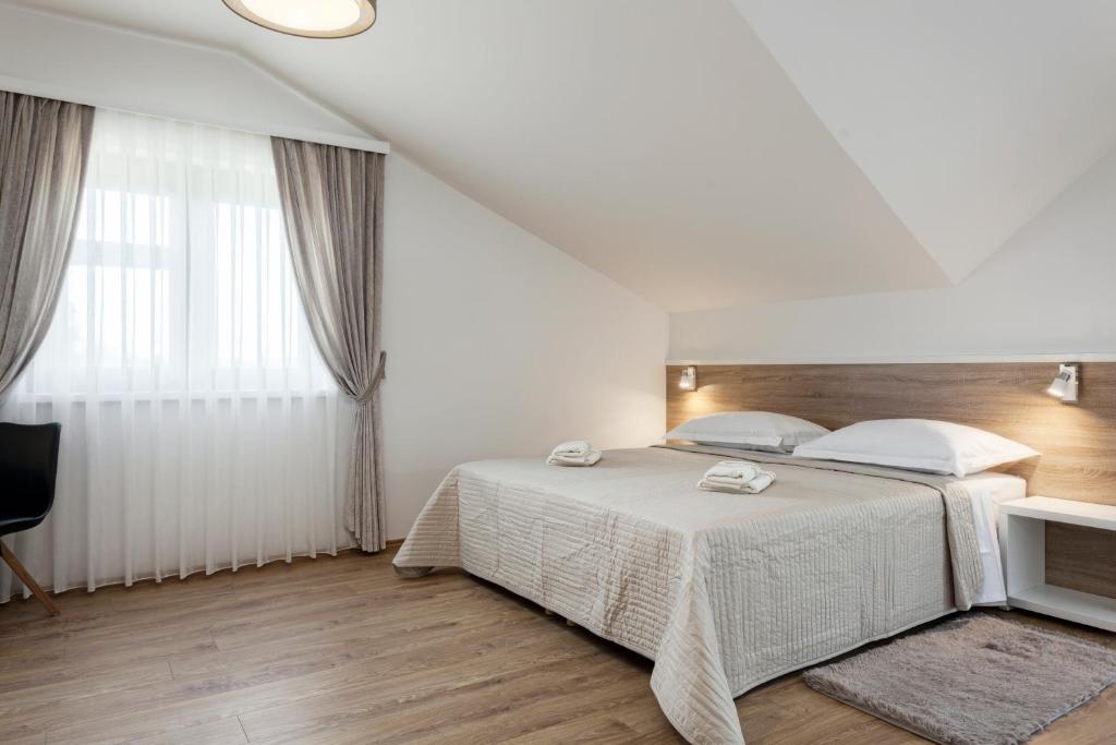 Posteľ alebo postele v izbe v ubytovaní Tourist Center Marko