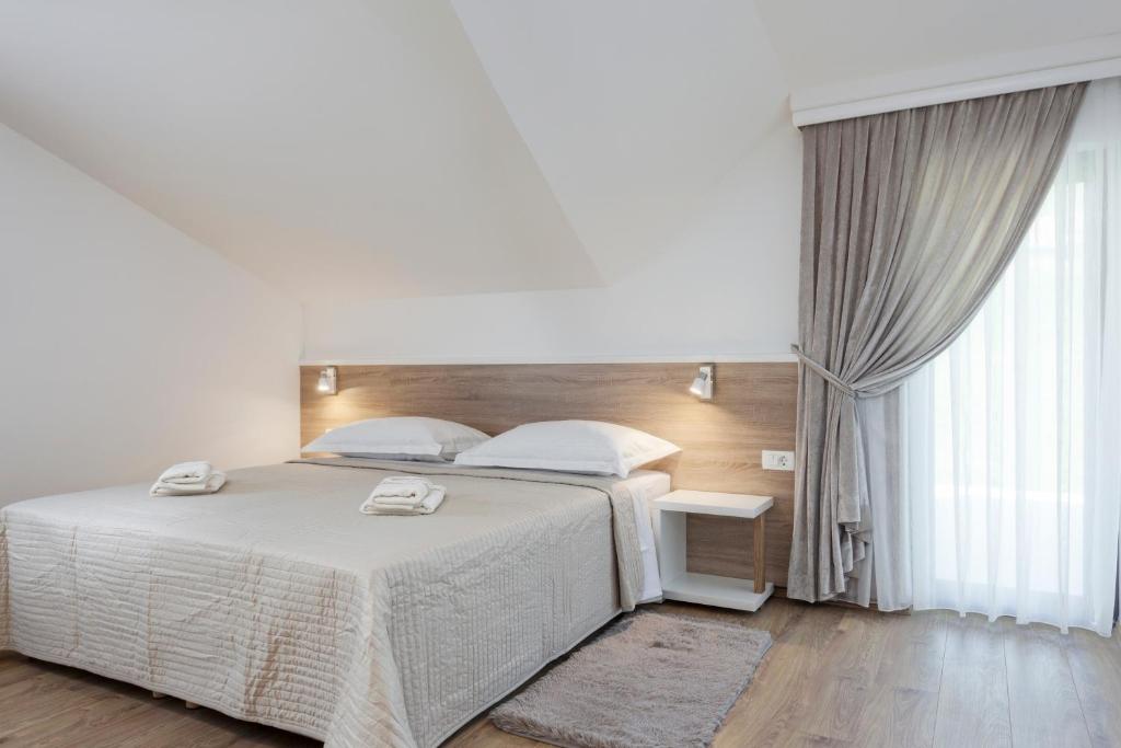 Posteľ alebo postele v izbe v ubytovaní Tourist Center Marko