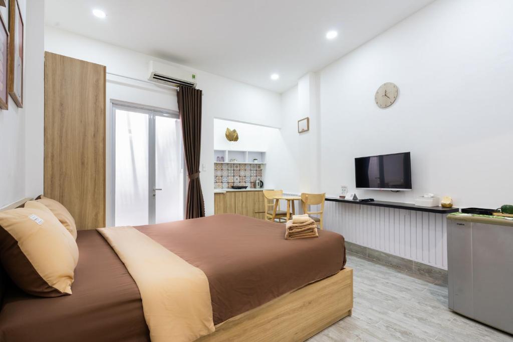 TV/trung tâm giải trí tại Ekomo Home - Central Saigon