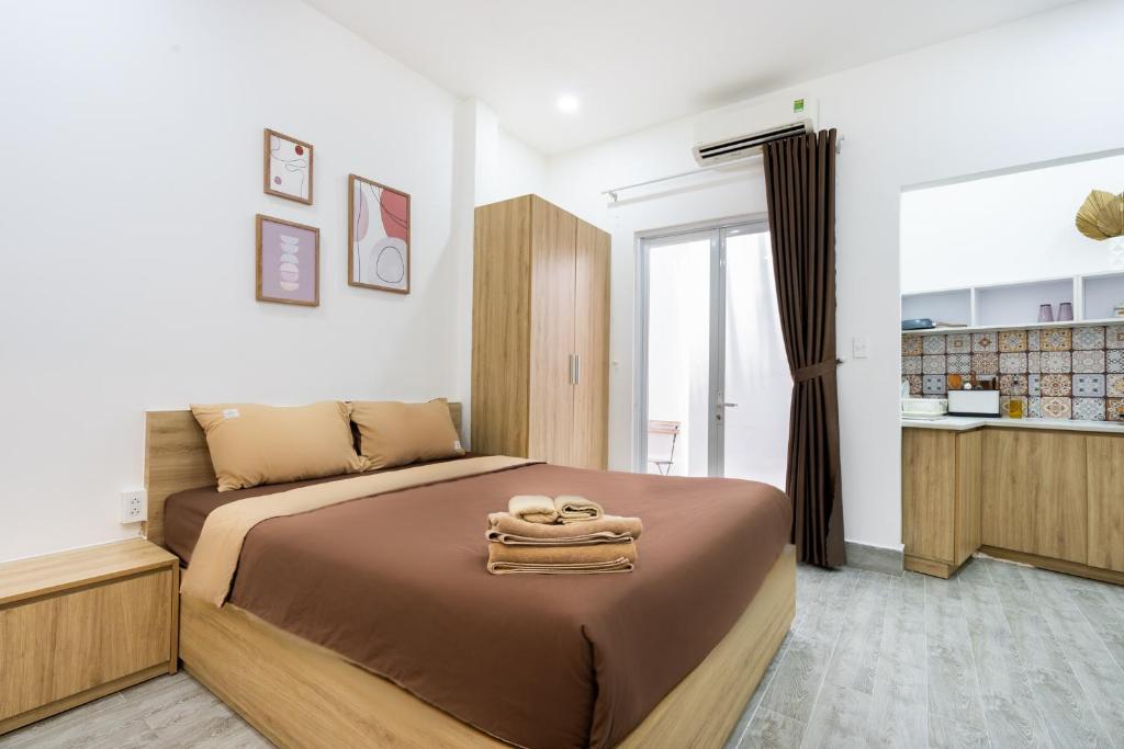 Giường trong phòng chung tại Ekomo Home - Central Saigon