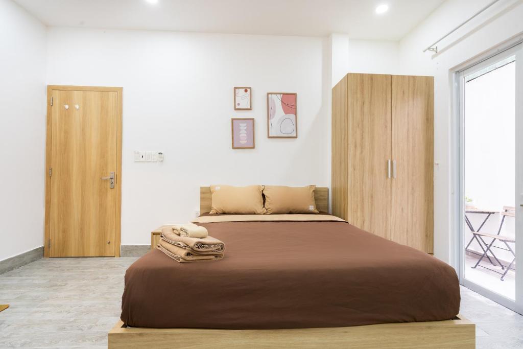 Giường trong phòng chung tại Ekomo Home - Central Saigon