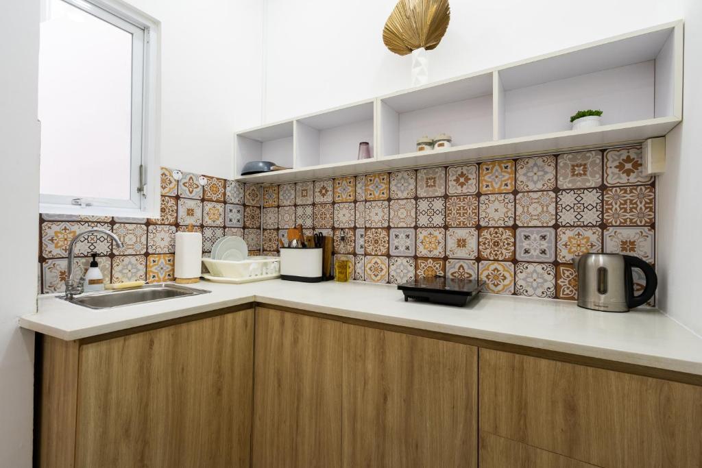 Nhà bếp/bếp nhỏ tại Ekomo Home - Central Saigon