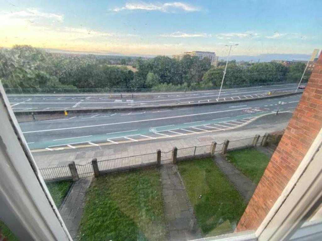 a view of a highway from the window of a building at Extra large 6 bed 7 bath townhouse in Manchester in Manchester