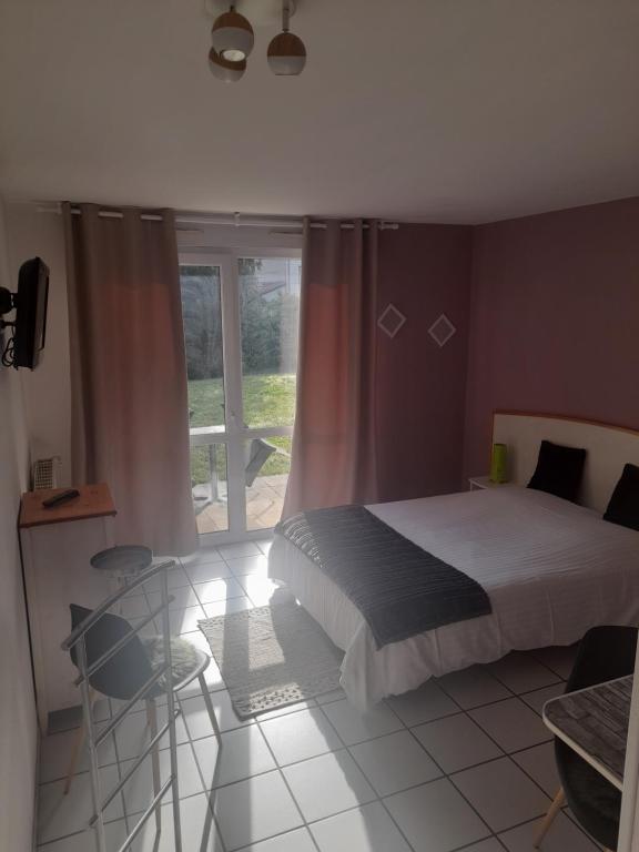 Postel nebo postele na pokoji v ubytování Hotel de l'Ile d'Amour