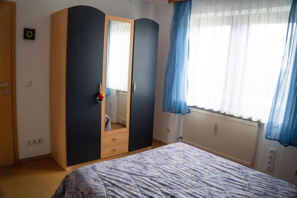 Postel nebo postele na pokoji v ubytování Urlaub mit verglaster Terrasse