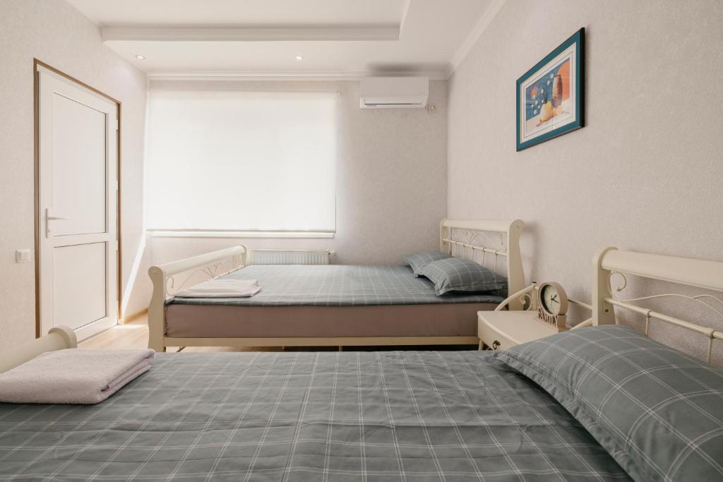 Postel nebo postele na pokoji v ubytování Marcos Hotel