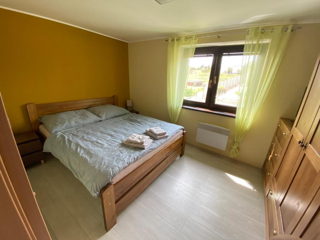Postel nebo postele na pokoji v ubytování Apartmány u Moravčíků
