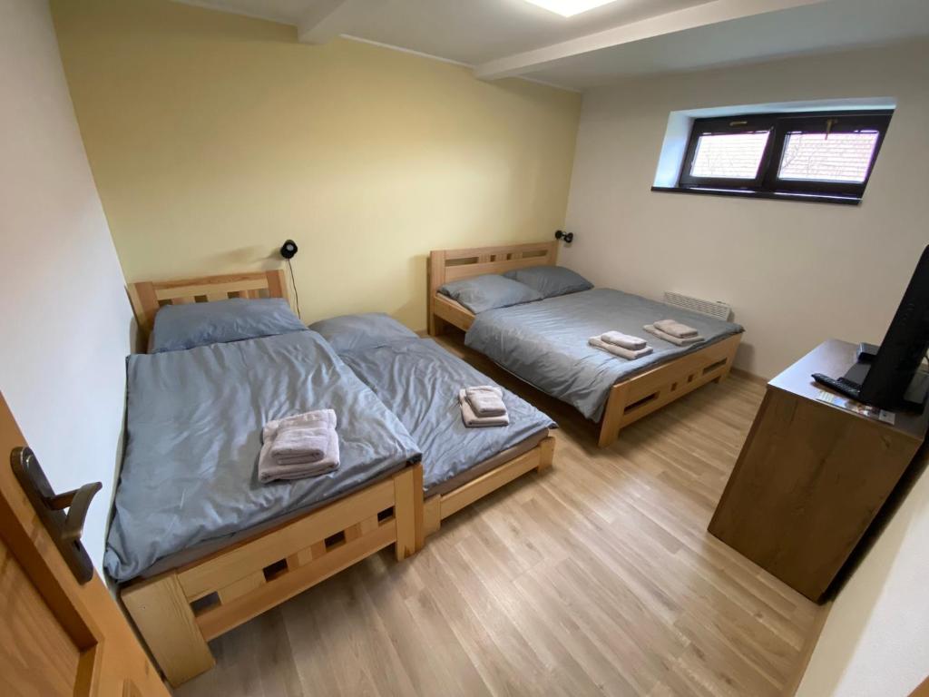 Postel nebo postele na pokoji v ubytování Apartmány u Moravčíků