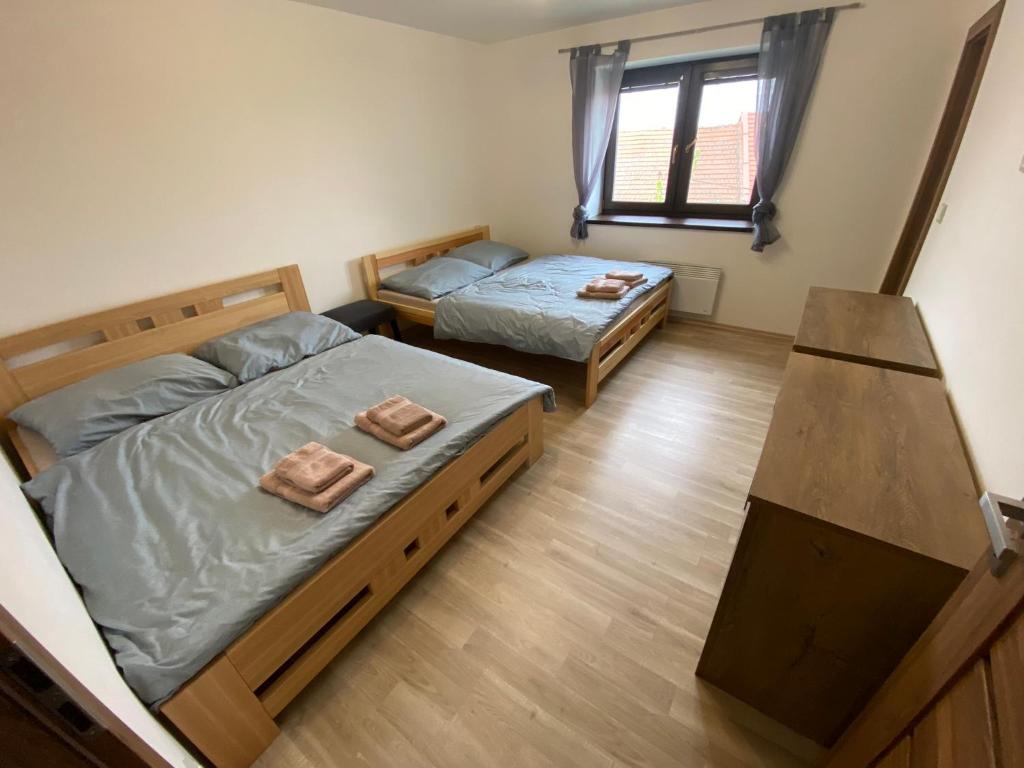 Postel nebo postele na pokoji v ubytování Apartmány u Moravčíků