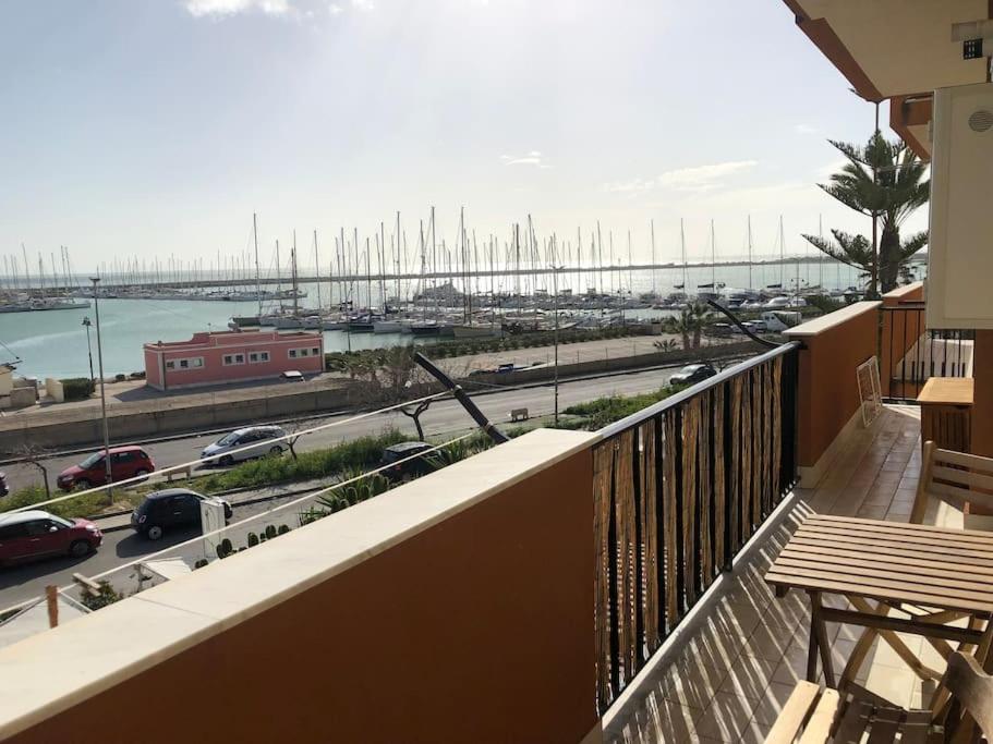 a balcony with a view of a harbor and a marina at Casa Porto Turistico in Licata