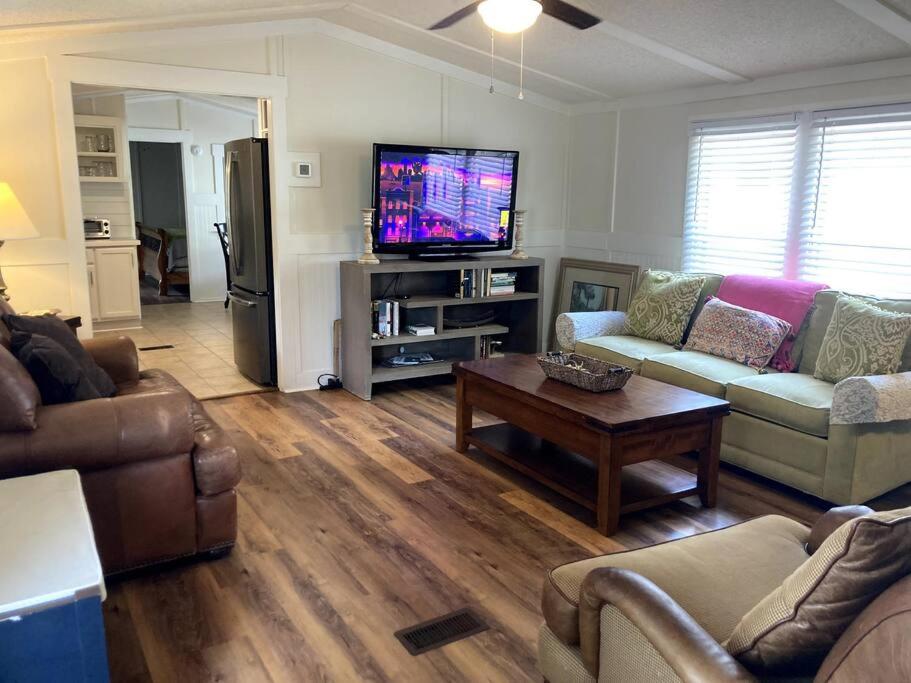 a living room with two couches and a tv at Beaufort SC New Renovation, Close to Parris Island, Historic Downtown, Beautiful Beaches, Sleeps 8 in Beaufort