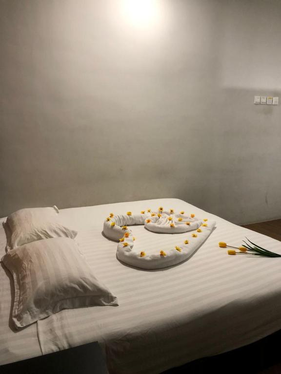 Postel nebo postele na pokoji v ubytování Amigo Hotel