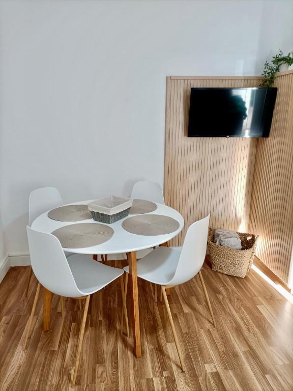 Televízia a/alebo spoločenská miestnosť v ubytovaní Apartamento de Julia
