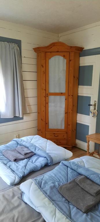 Postel nebo postele na pokoji v ubytování Davids Stuga