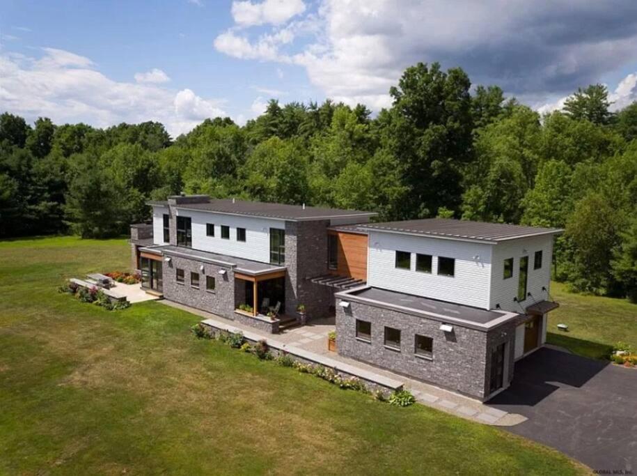 an aerial view of a house with a yard at Rig Veda House - Saratoga Estate Property 