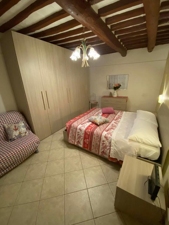 a bedroom with a bed and a table in it at Casa Maria in Portoferraio
