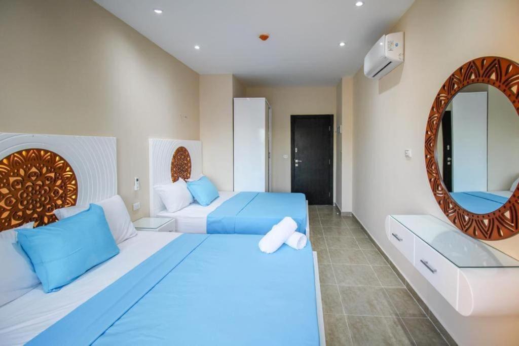 1-bedroom apartment with 2 balconies overlooking the pool and aqua park in View Aqua Apartments and Suits in Mirage Bay Resort & Aquapark Hotelm in Mirage Bay Resort and Aquapark