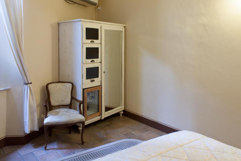 Postel nebo postele na pokoji v ubytování Albergo Il Giglio