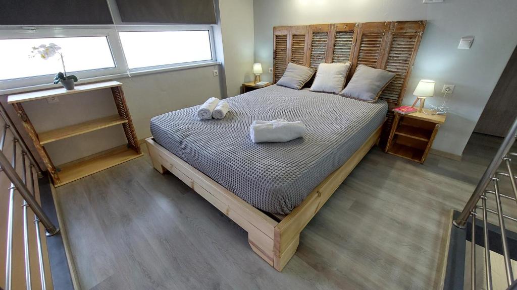 A bed or beds in a room at EA Lofthouse