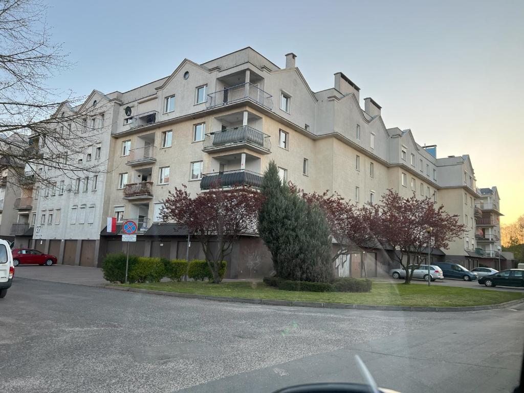 a large apartment building on the side of a street at Osiedle Leśne 37/28 in Oborniki