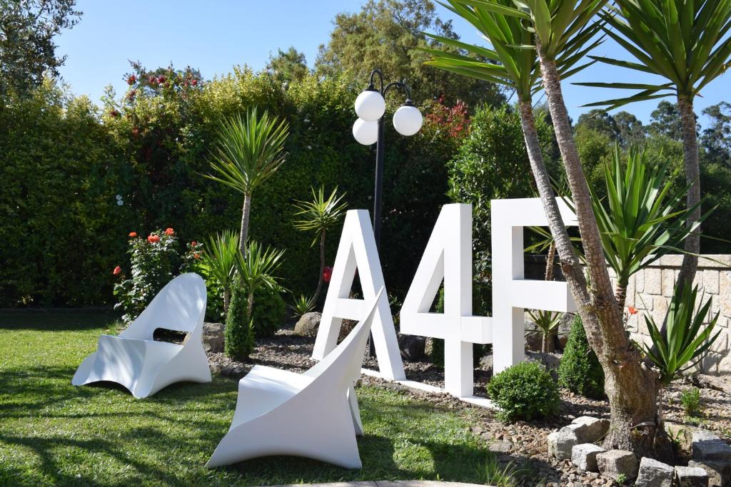Um jardim no exterior de Alagoas4Family - Country House
