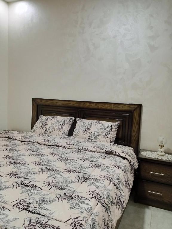 Postel nebo postele na pokoji v ubytování Jerash air apartment