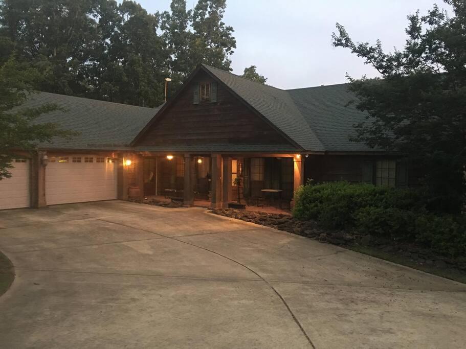 a house with a garage and a driveway at Oxford Chalet Getaway with Lake/Beach Access in Oxford