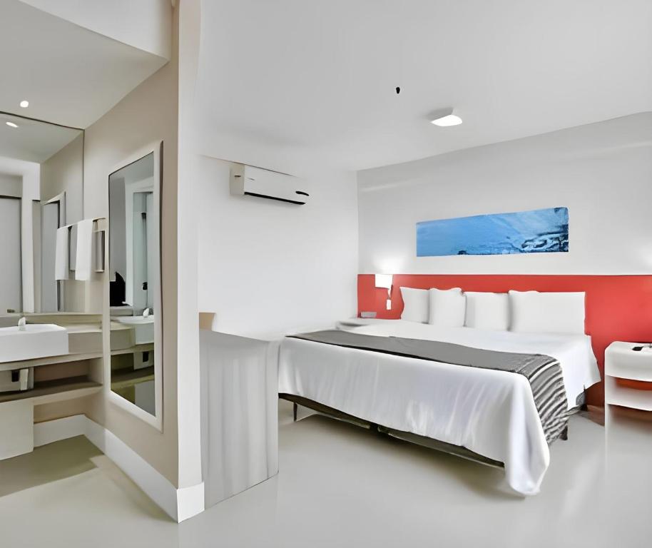 Кровать или кровати в номере True América apart-hotel