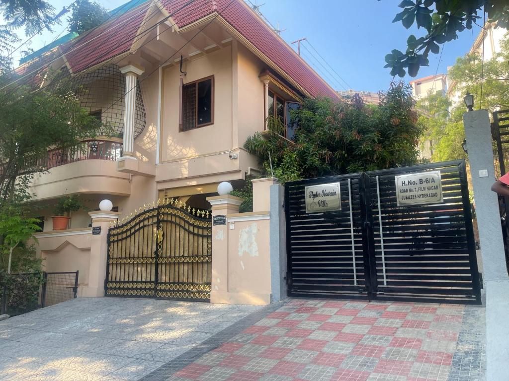 a house with a gate in front of it at Elegant & Luxurious Villa at Film Nagar, Jubilee Hills near Apollo in Hyderabad