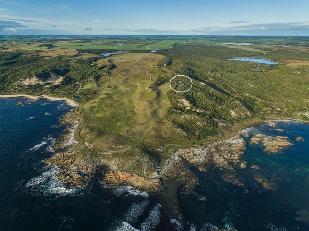 an aerial view of an island in the ocean at Buttons By The Beach - beach house on King Island 