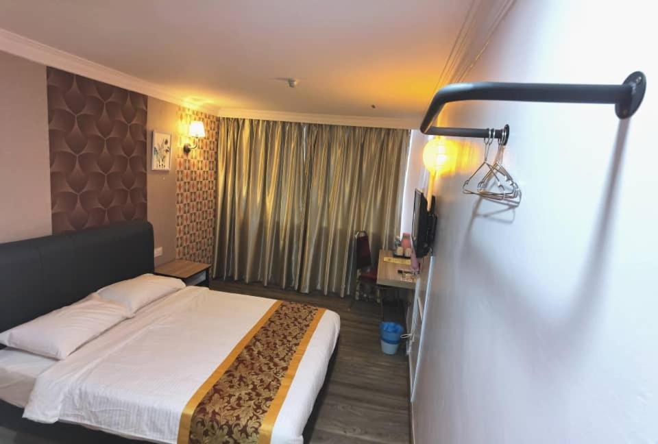 Postel nebo postele na pokoji v ubytování Hotel Ching Hua