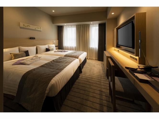 Postel nebo postele na pokoji v ubytování HOTEL OLE INN