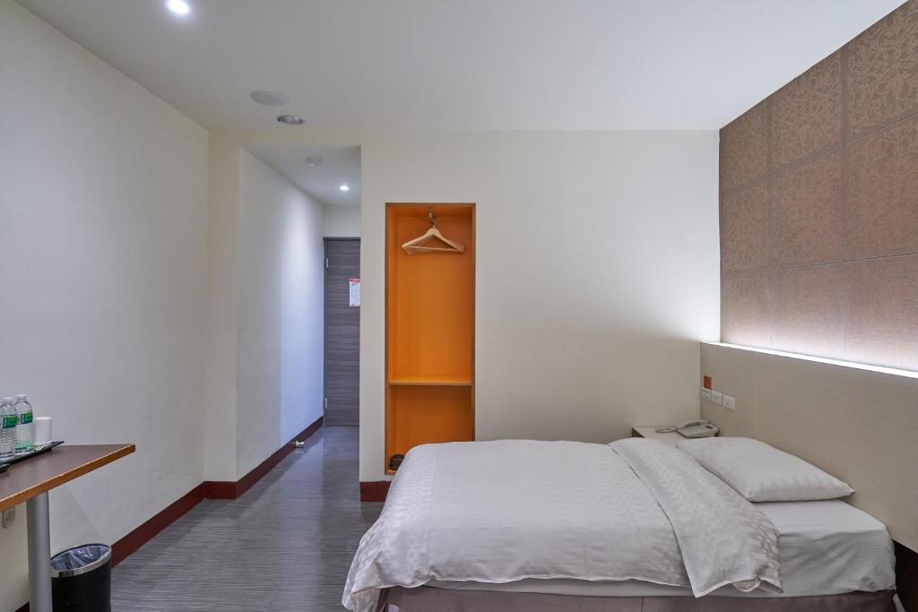 Yung An Business Hotel客房内的一张或多张床位