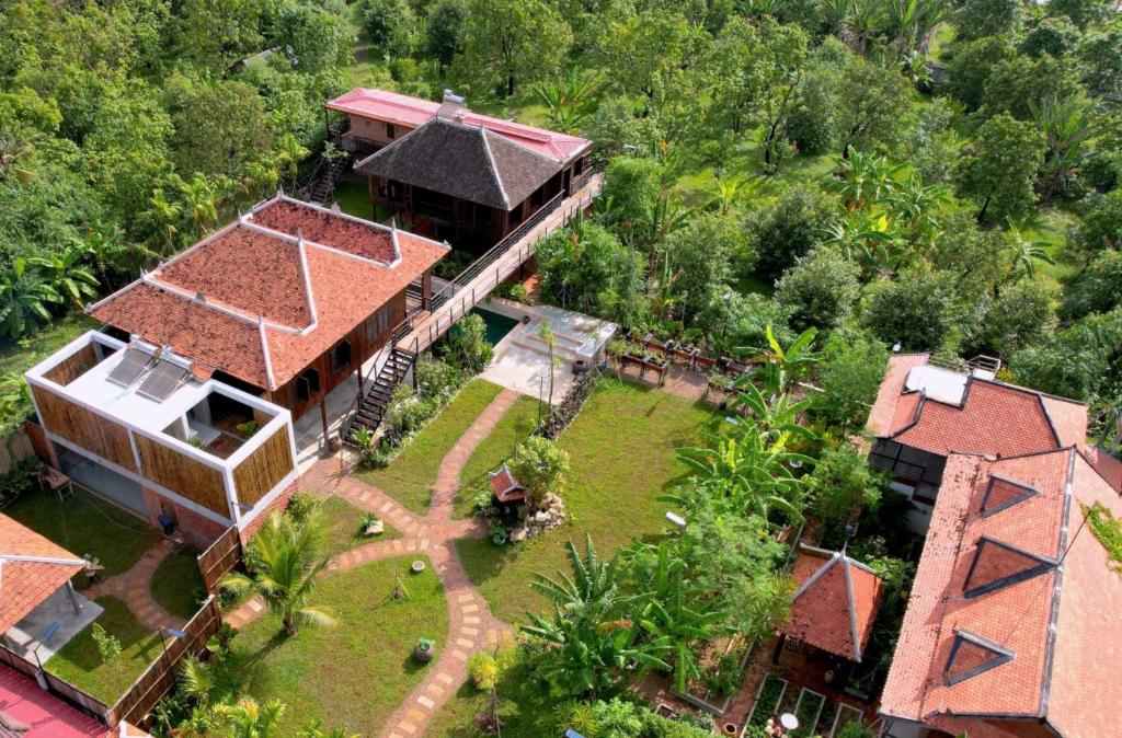 an aerial view of a house with a yard at Chef Nak Luxury Homestay in Phnom Penh