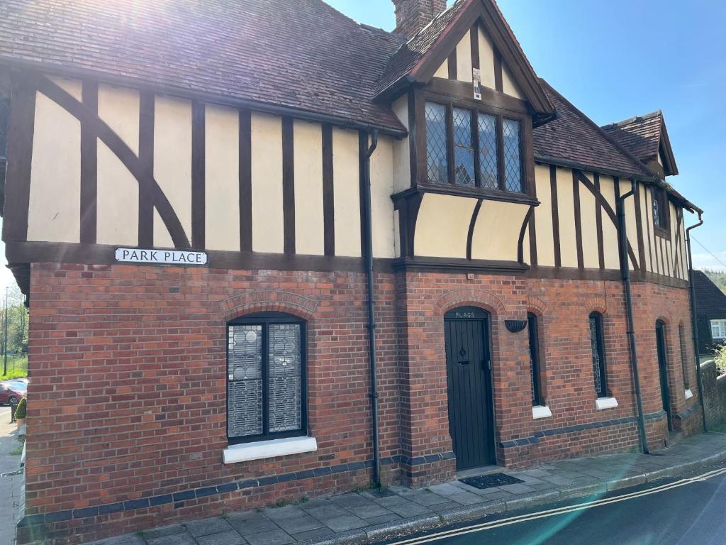 an old brick building with a black and white facade at Arundel Maltravers in Arundel